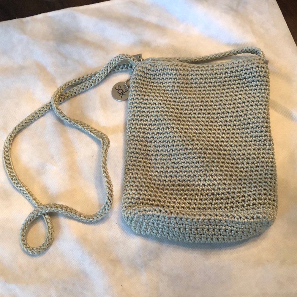 Moved The Sak classic oblong crochet lined zipper close crossbody mint green bag
